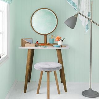 dressing table with a stool and mirror and makeup storage