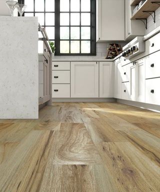 white kitchen with wood effect vinyl flooring by Lowes
