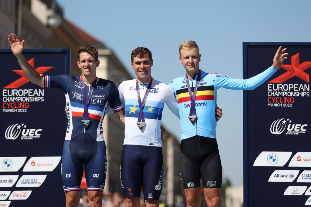 MUNICH GERMANY AUGUST 14 Silver medalist Arnaud Demare of France gold medalist Fabio Jakobsen of Netherlands and bronze medalist Tim Merlier of Belgium pose on the podium during the medal ceremony after the 28th UEC Road Cycling European Championships 2022 Mens Road Race a 2079km one day race from Murnau to Munich EuroRoad22 Munich2022 on August 14 2022 in Munich Germany Photo by Jan HetfleischGetty Images