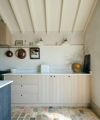 Wooden drawers and cabinets and white beams