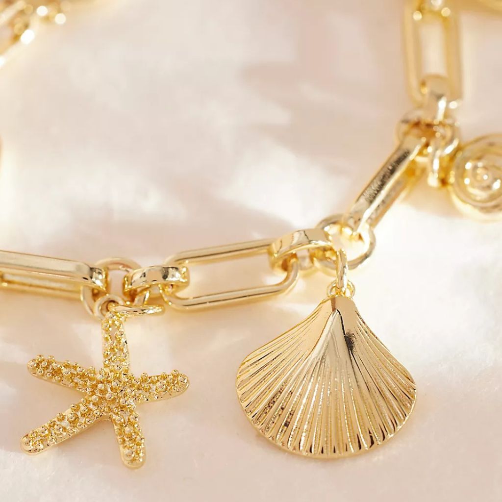 A lifestyle image of the mixed shell charm bracelet 