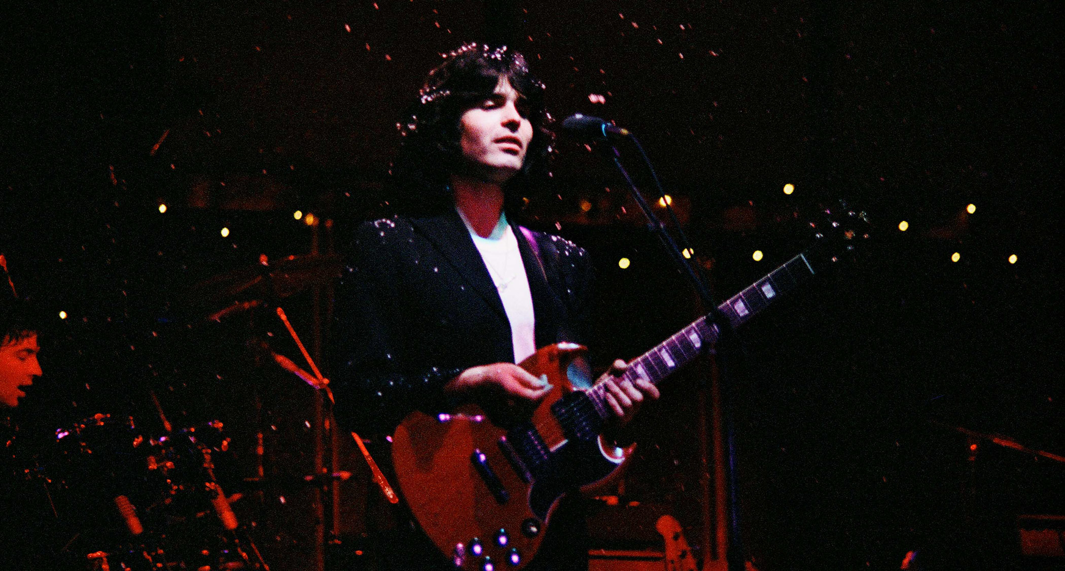 Laurence Juber of Wings performs with a Gibson SG.