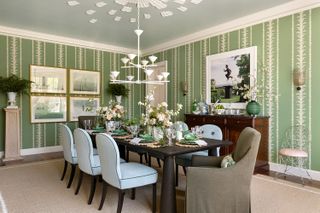 green dining room with blue chairs