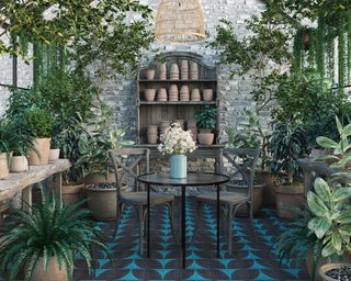 Indoor-outdoor conservatory space with black and blue tile design, lots of plants in ceramic pots, hanging plants on ceiling