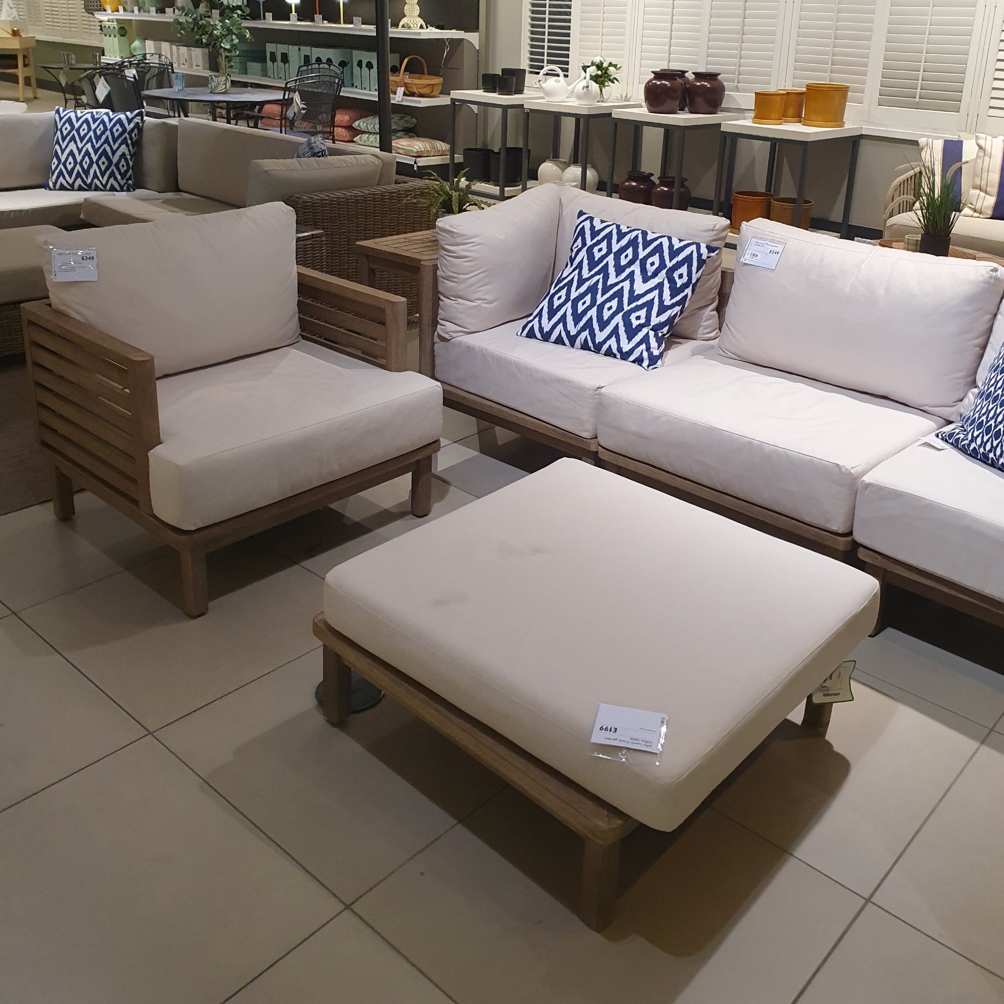 The John Lewis Coast outdoor lounge set made from acacia wood displayed in the John Lewis Oxford Street store