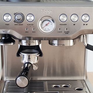 Sage The Barista Express BES875UK Espresso Coffee Machine on a wooden table