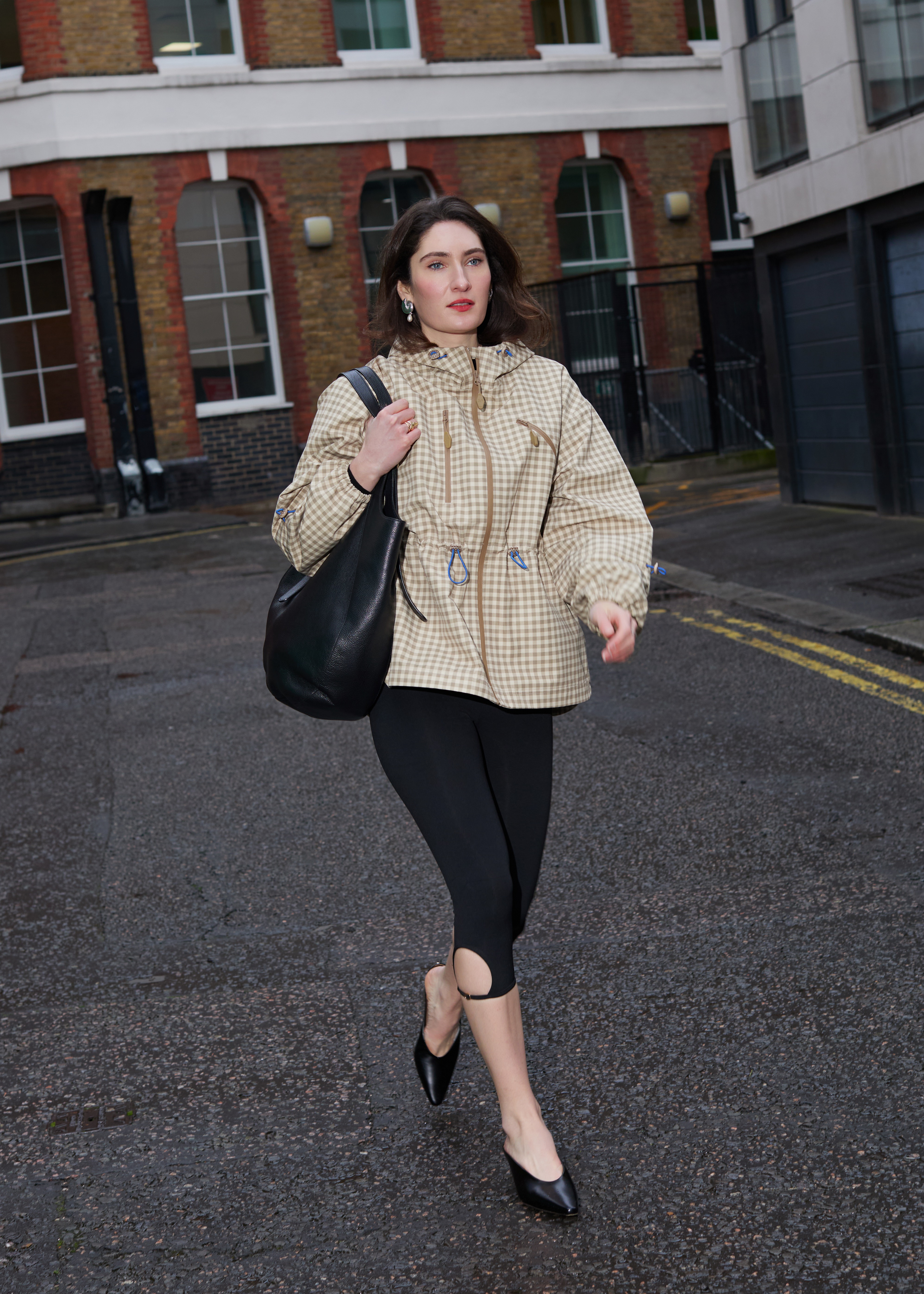 An image of News Writer Natalie Munro wearing a Damson Madder raincoat.