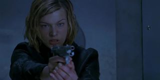 Milla Jovovich with a gun