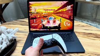MacBook Air 15-inch M3 playing Grid Legends racing game with PS5 controller