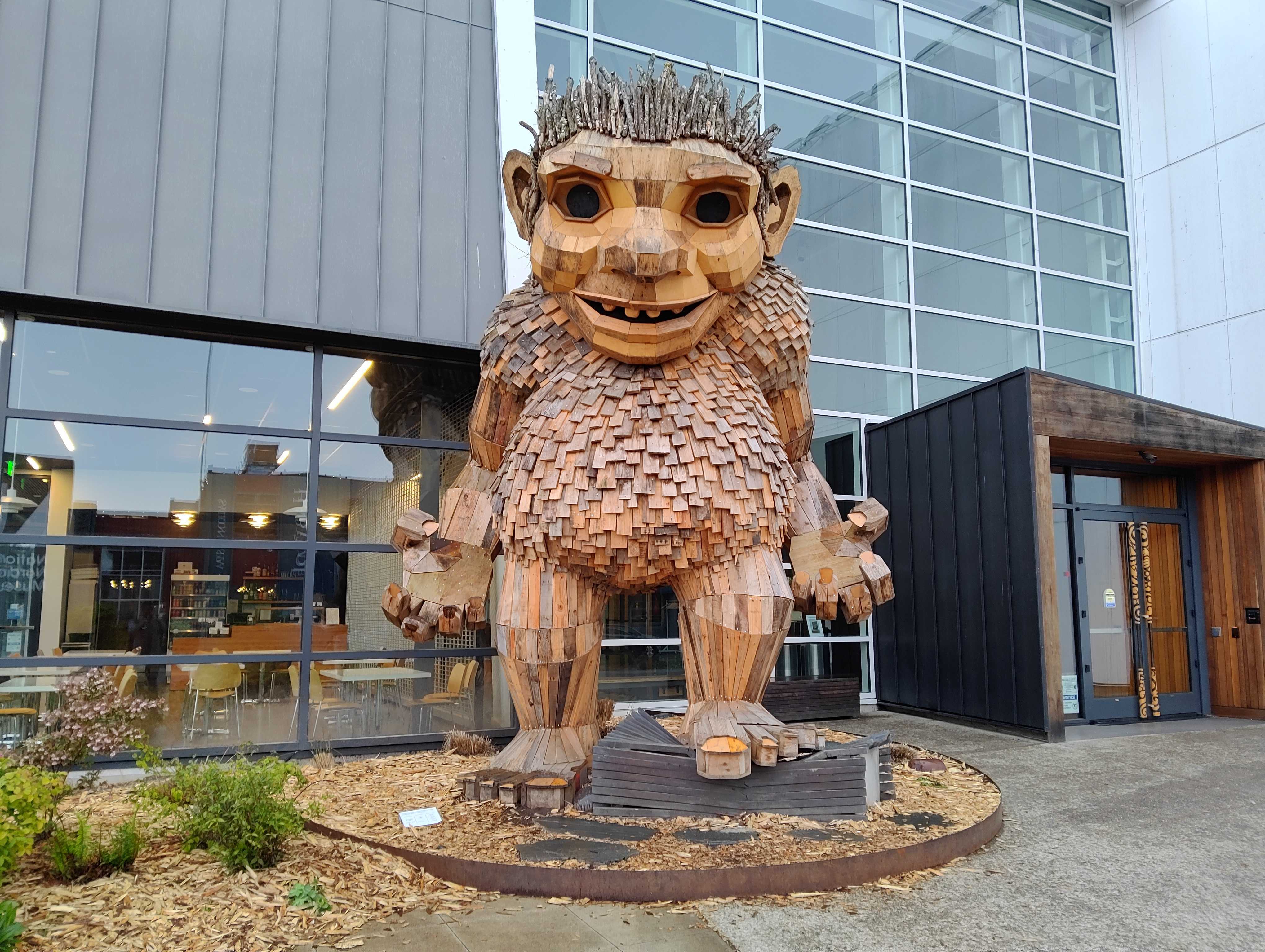 A wooden statue of a troll