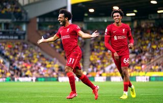Liverpool’s Mohamed Salah (left) celebrates with Trent Alexander-Arnold after scoring their side’s third goal of the game during the Premier League match at Carrow Road, Norwich. Picture date: Saturday August 14, 2021