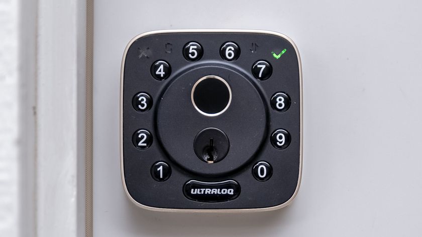 An unlocked U-tec UltraLoq Bolt Fingerprint Matter installed on a door