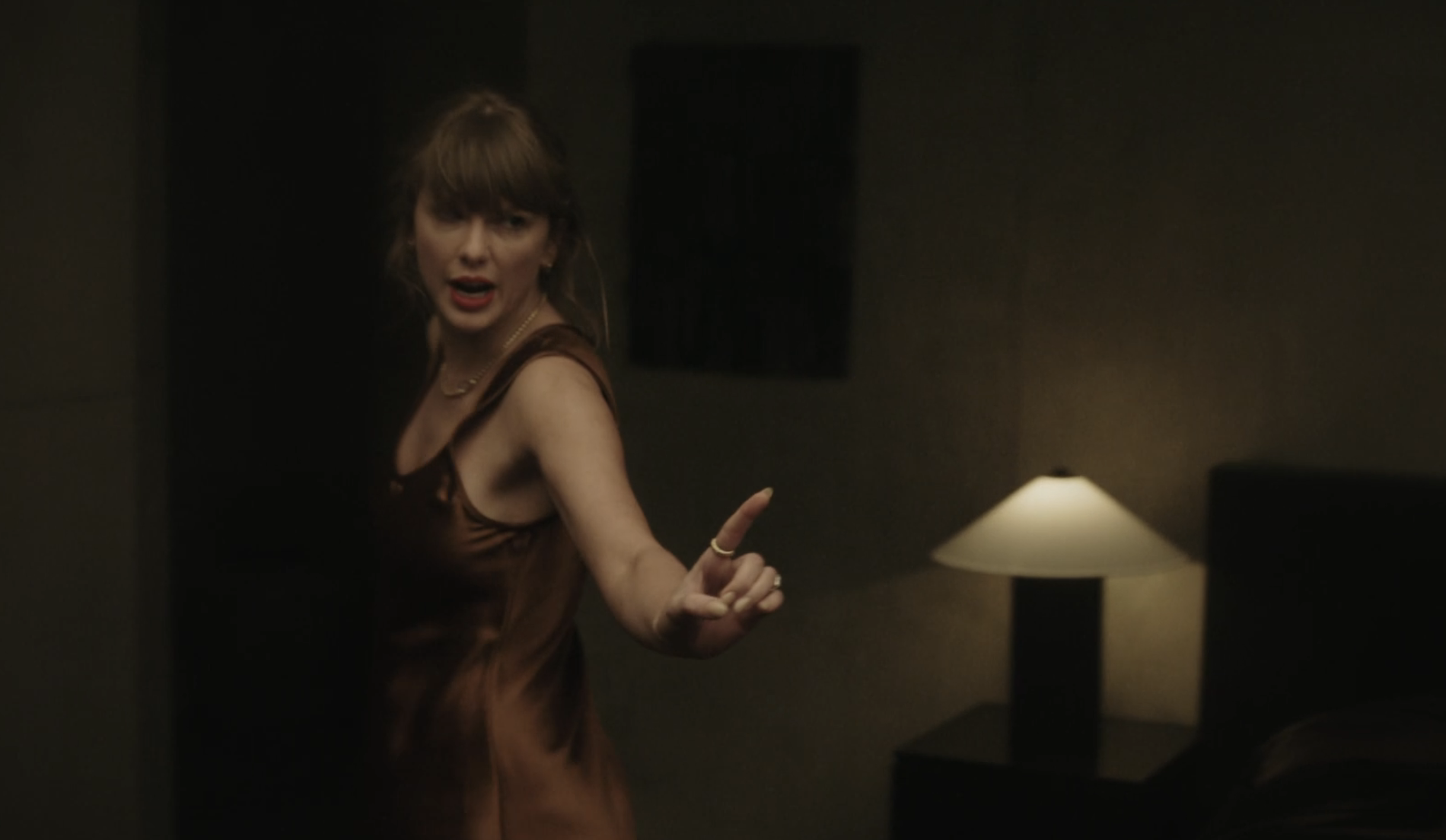 Taylor Swift and Dakota Johnson outfits in the "Patient Zero" music video