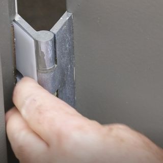 Silver door hinge with hinge packer