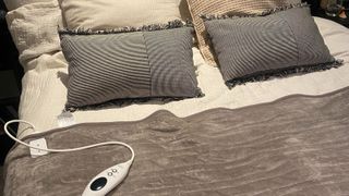 Best electric blanket on bed cream bedding and grey