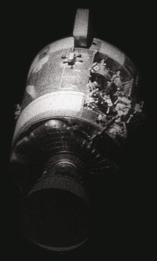 The view of Apollo 13's service module revealing the exploded oxygen tank.