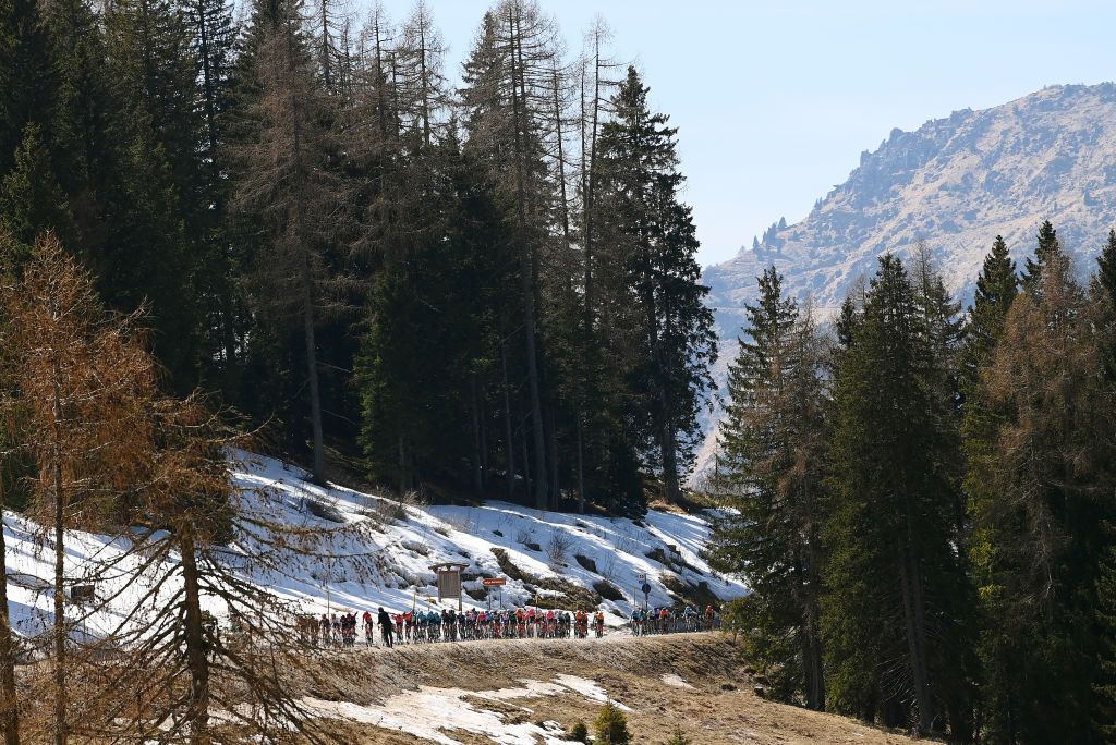 SAN MARTINO DI CASTROZZA ITALY APRIL 18 A general view of the peloton passing through a Passo Brocon 1616m landscape during the 45th Tour of the Alps 2022 Stage 1 a 1609km stage from Cles to PrimieroS Martino di Castrozza 708m TouroftheAlps on April 18 2022 in San Martino di Castrozza Italy Photo by Tim de WaeleGetty Images