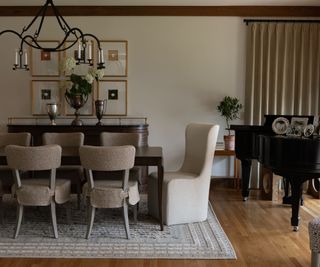 cozy arts and crafts dining room with a large piano in the corner