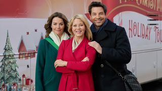 Erica Durance, Barbara Niven, Brennan Elliott pose in Ms. Christmas Comes to Town