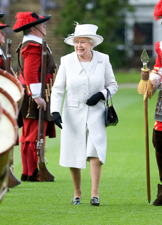 Queen Elizabeth II reviews the Company of Pikemen and Musketeers at HAC Armoury House on May 12, 2010 in London, England