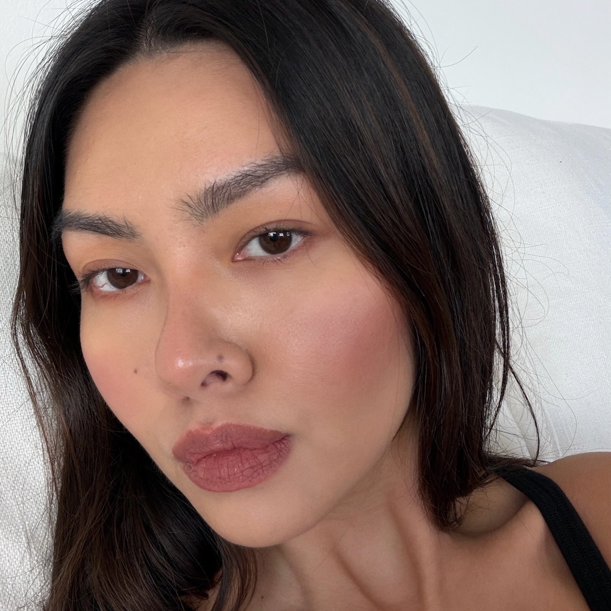 Woman with "cloud skin" AKA matte-finish makeup