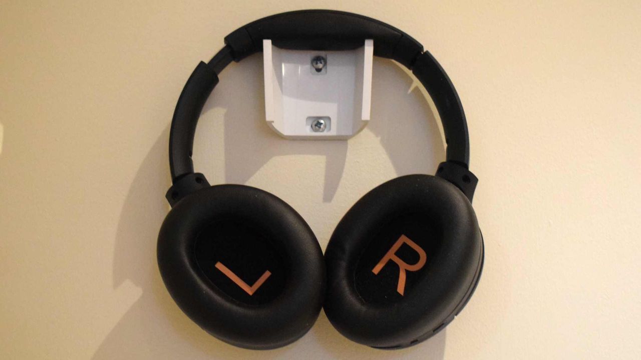 The Soundpeats Cove Pro hanging up, and with the inside of each cup facing outwards.