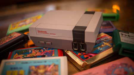 a NES on top of a pile of carts