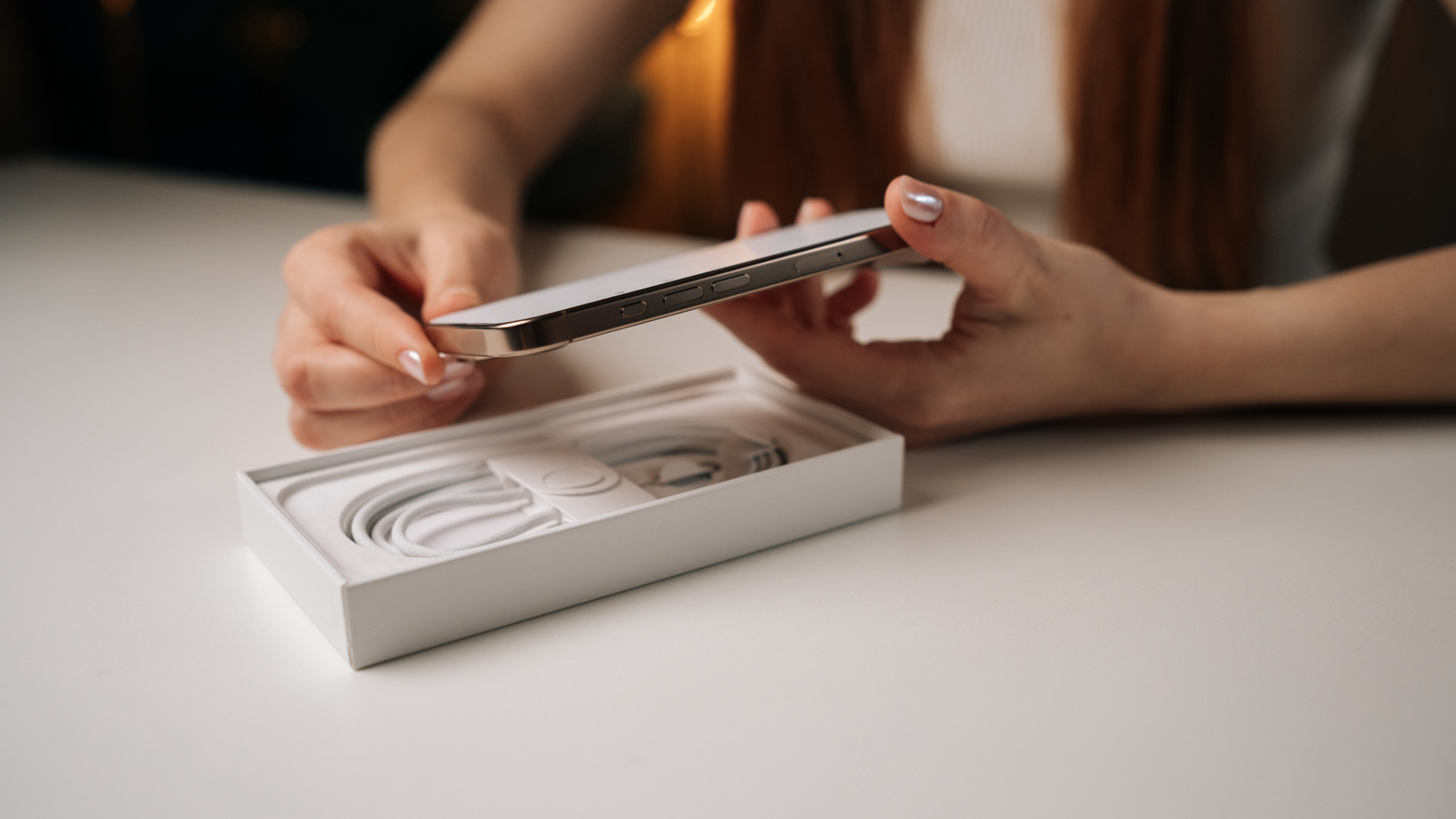 A person unboxing an iPhone