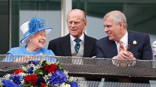 Queen Elizabeth II, Prince Philip, Duke of Edinburgh and Prince Andrew, Duke of York watch the racing from the balcony of the Royal Box