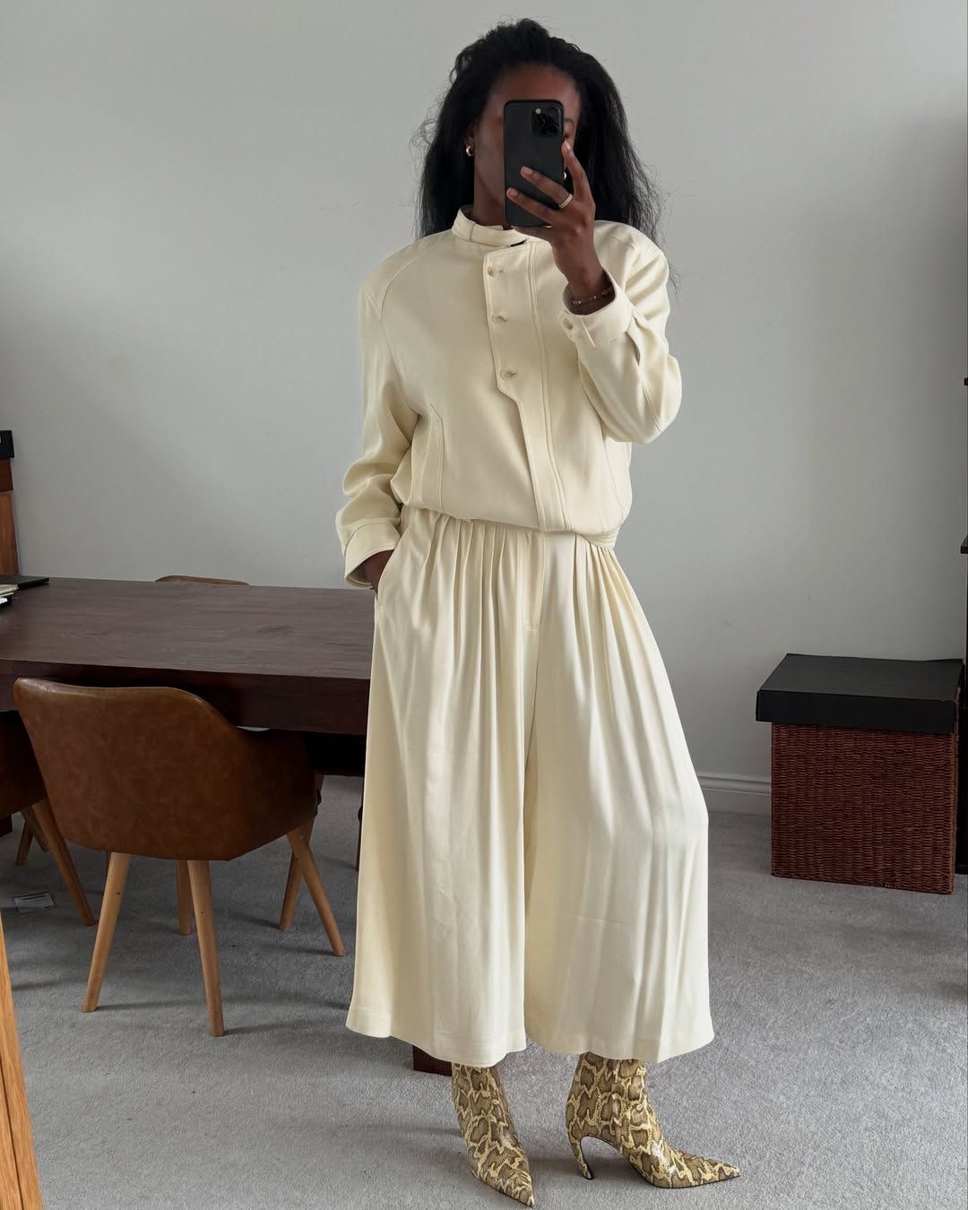 @nlmarilyn wears cream outfit snake print boots