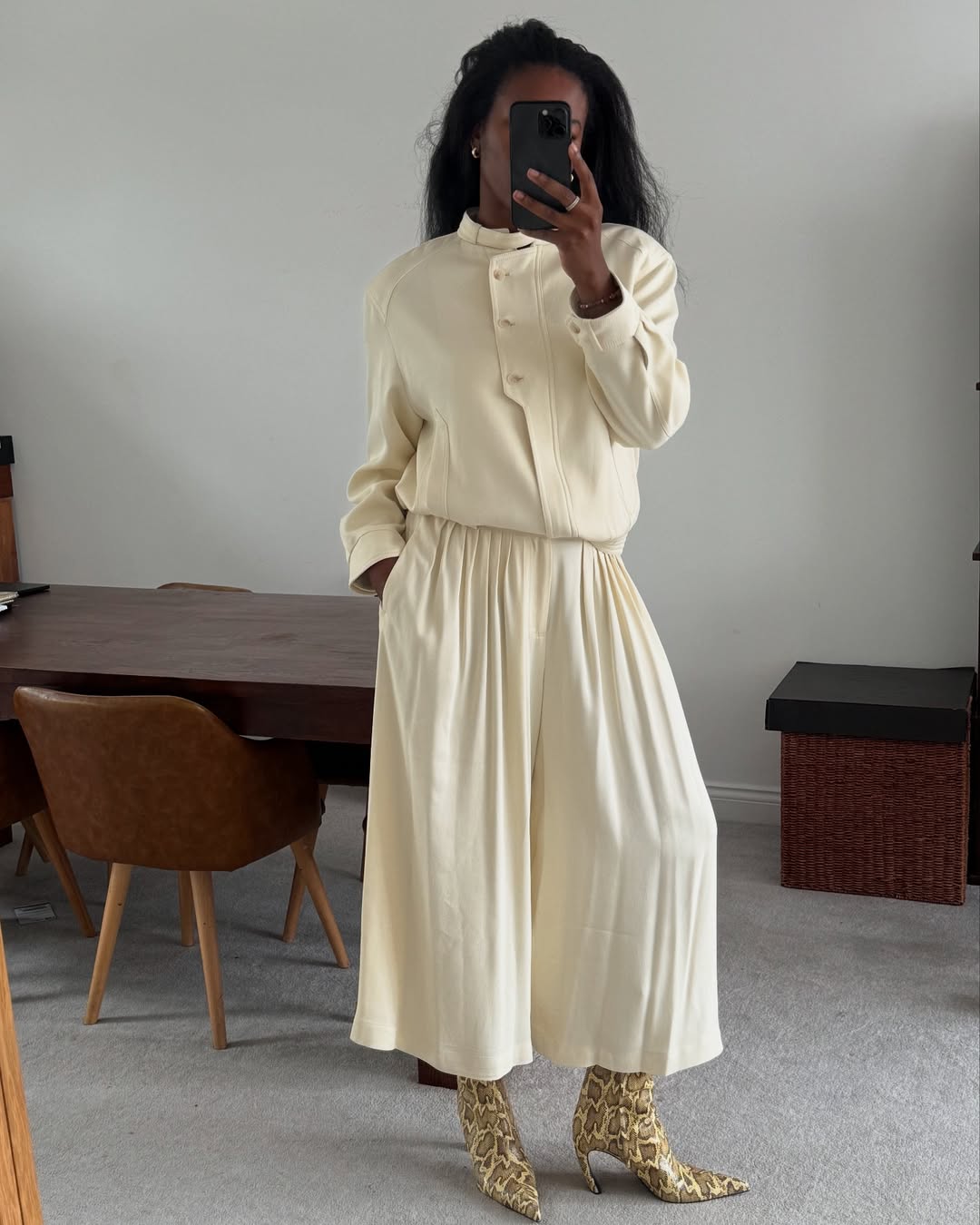 @nlmarilyn wears cream outfit snake print boots