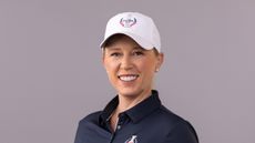 Morgan Pressel smiles while wearing 2024 Solheim Cup gear