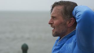 Profile of male man exercising in the rain