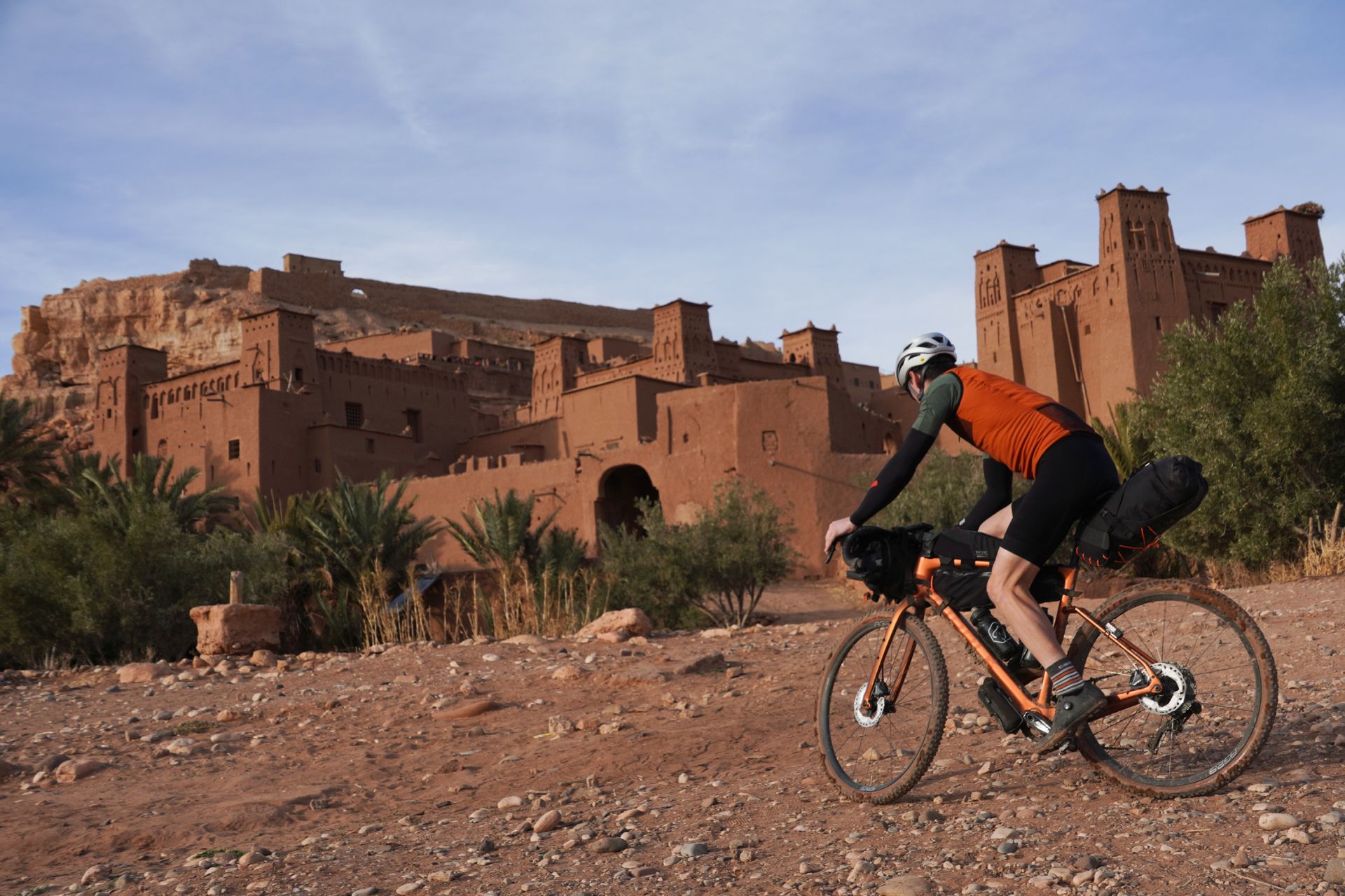 Image shows Stefan cycling towards Aït Benhaddou