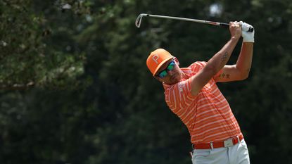 Rickie Fowler plays his shot from the fifth tee during the final round of the Travelers Championship.