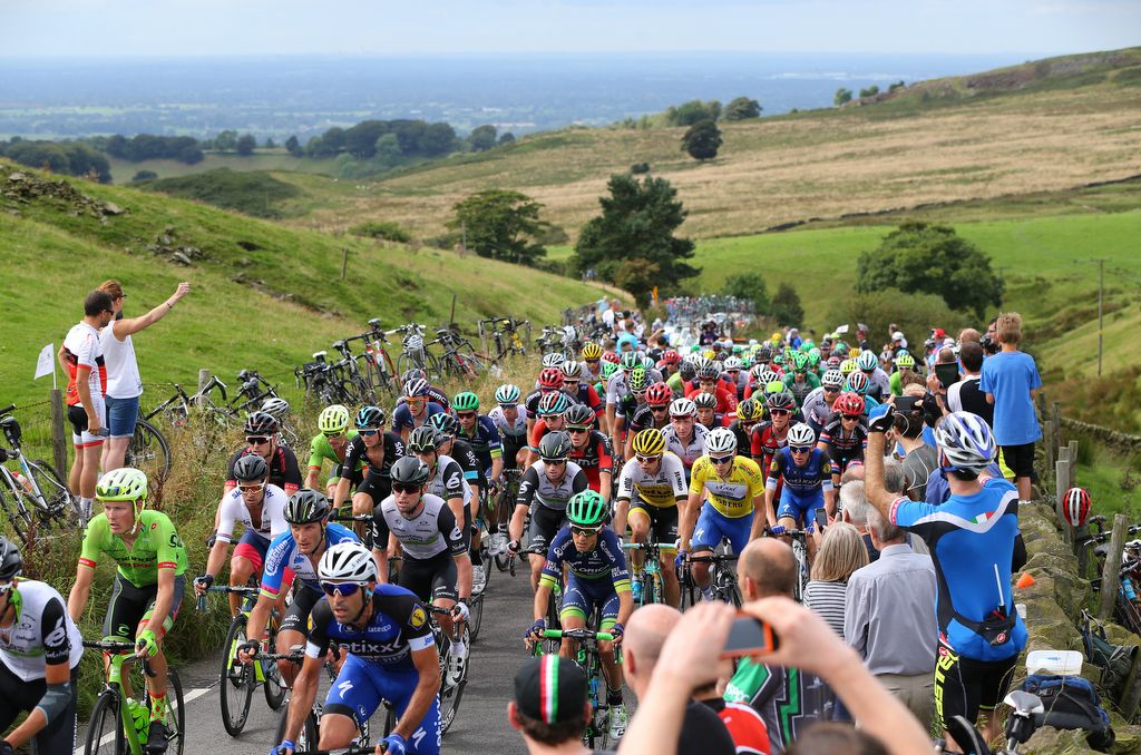 Race leader Julien Vermote climbing near the front in the yellow jersey