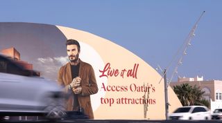 Cars pass an advertisement board featuring Qatar Ambassador David Beckham during the FIFA World Cup Qatar 2022 at Al Waab Street on December 03, 2022 in Doha, Qatar.