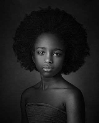 A portrait of a child in black and white