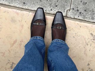 Flat black shoes with jeans.