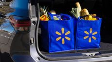 Reusable Walmart grocery bags in the trunk of a car.