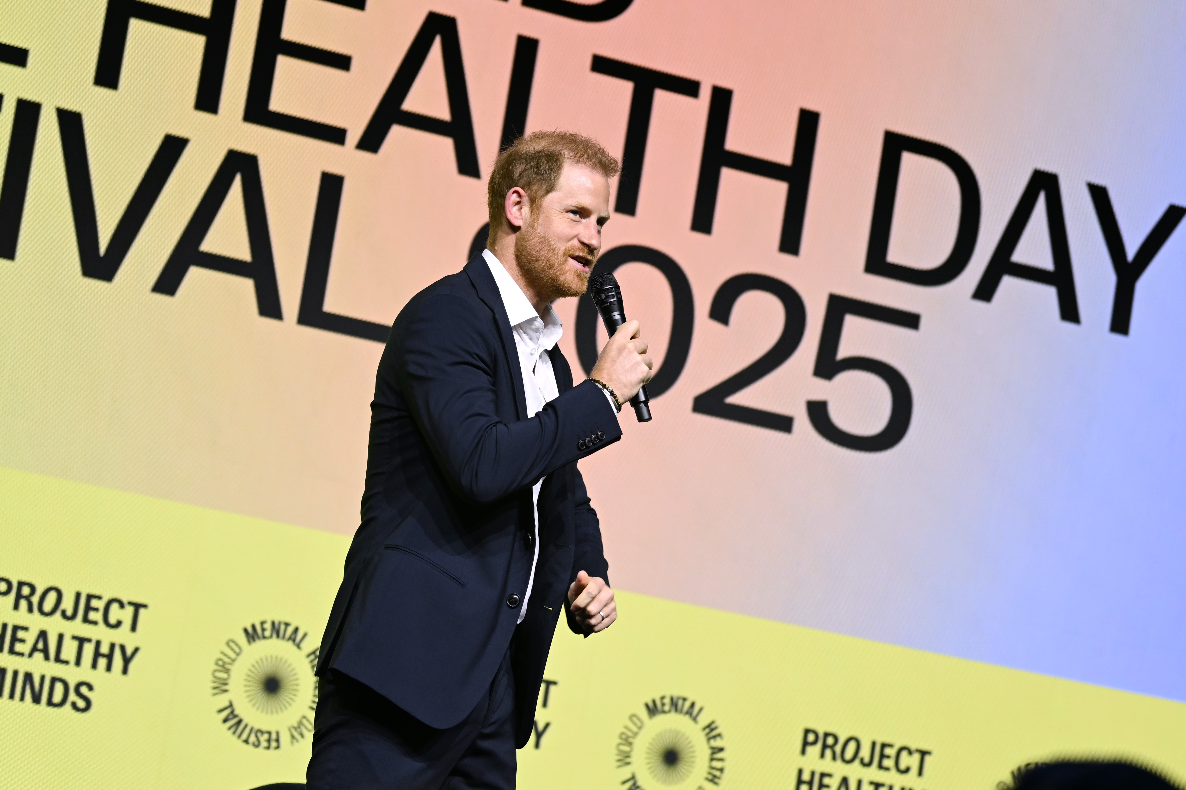 Prince Harry speaking on stage at World Mental Health Day Festival