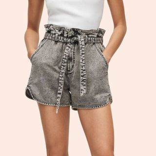 Flat lay images of woman wearing grey shorts