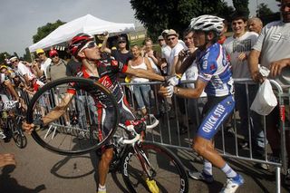 Rui Costa (Caisse d'Epargne) wrests a front wheel away from Carlos Barredo (Quick Step) after the Spaniard hit Costa with it following the stage 6 finish.