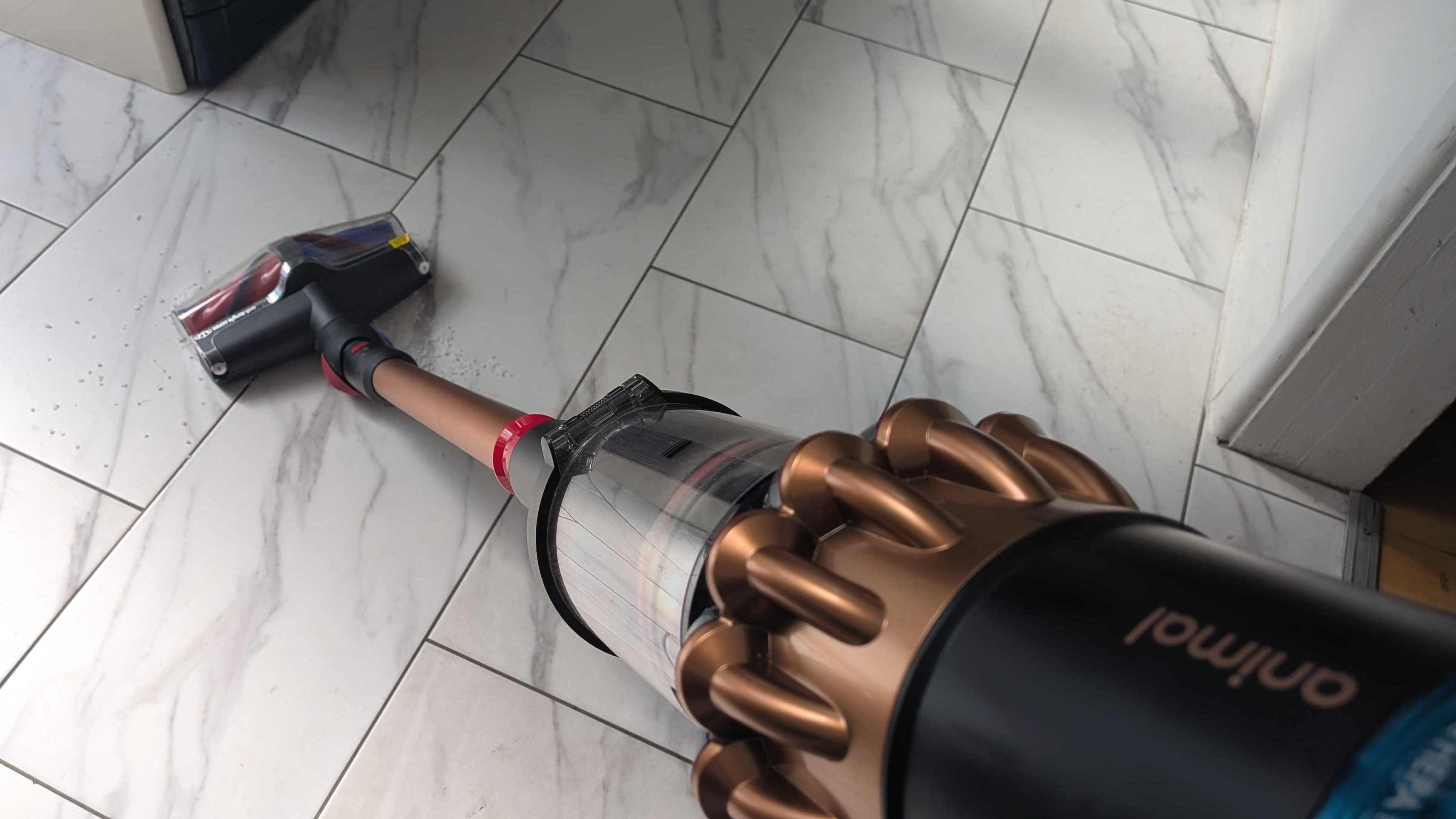 Dyson V16 cleaning white floor tiles