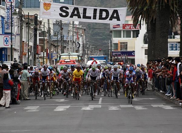 The peloton prepares to tackle a climb heading out of town.
