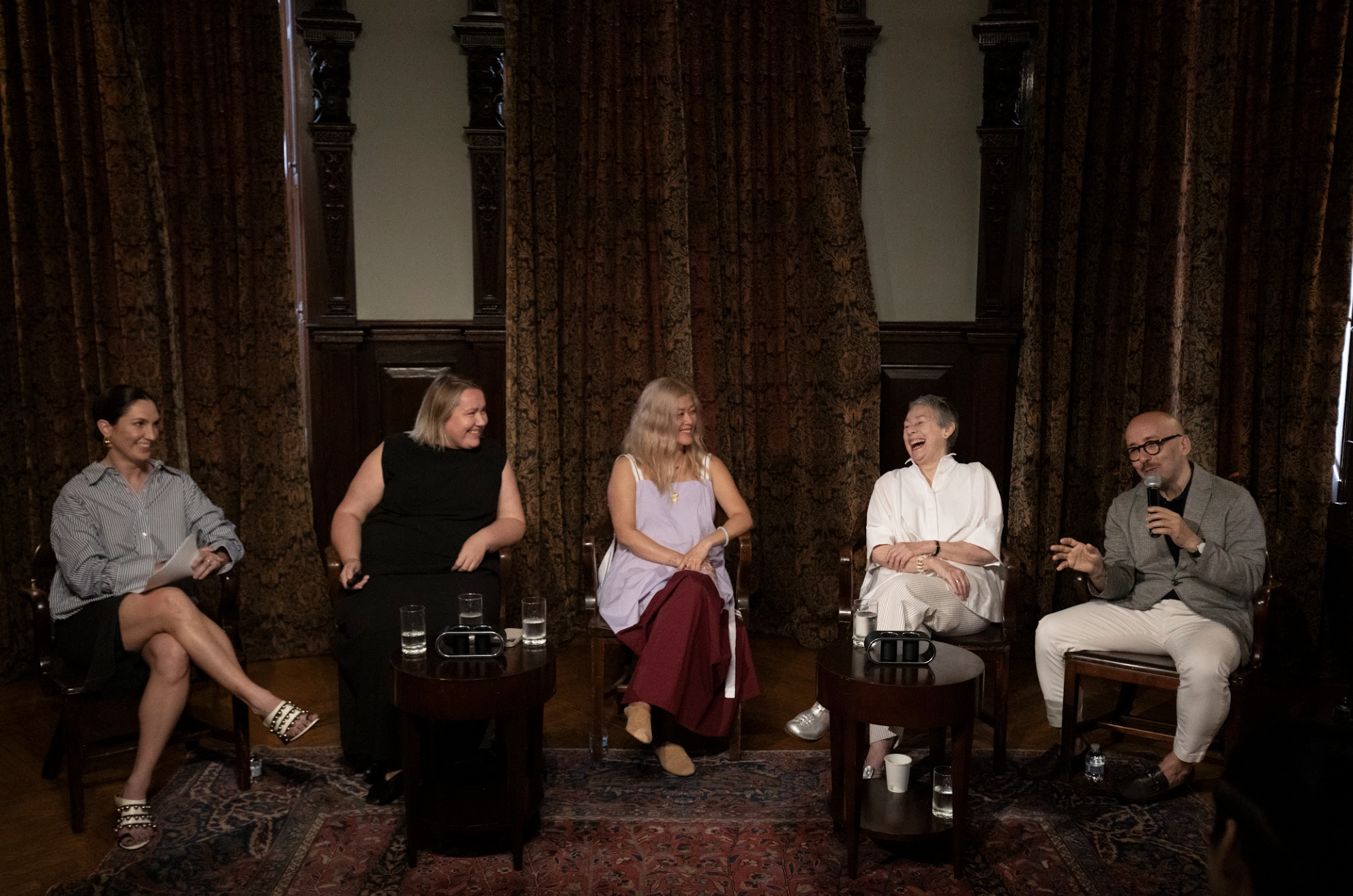 People on chairs talking and laughing