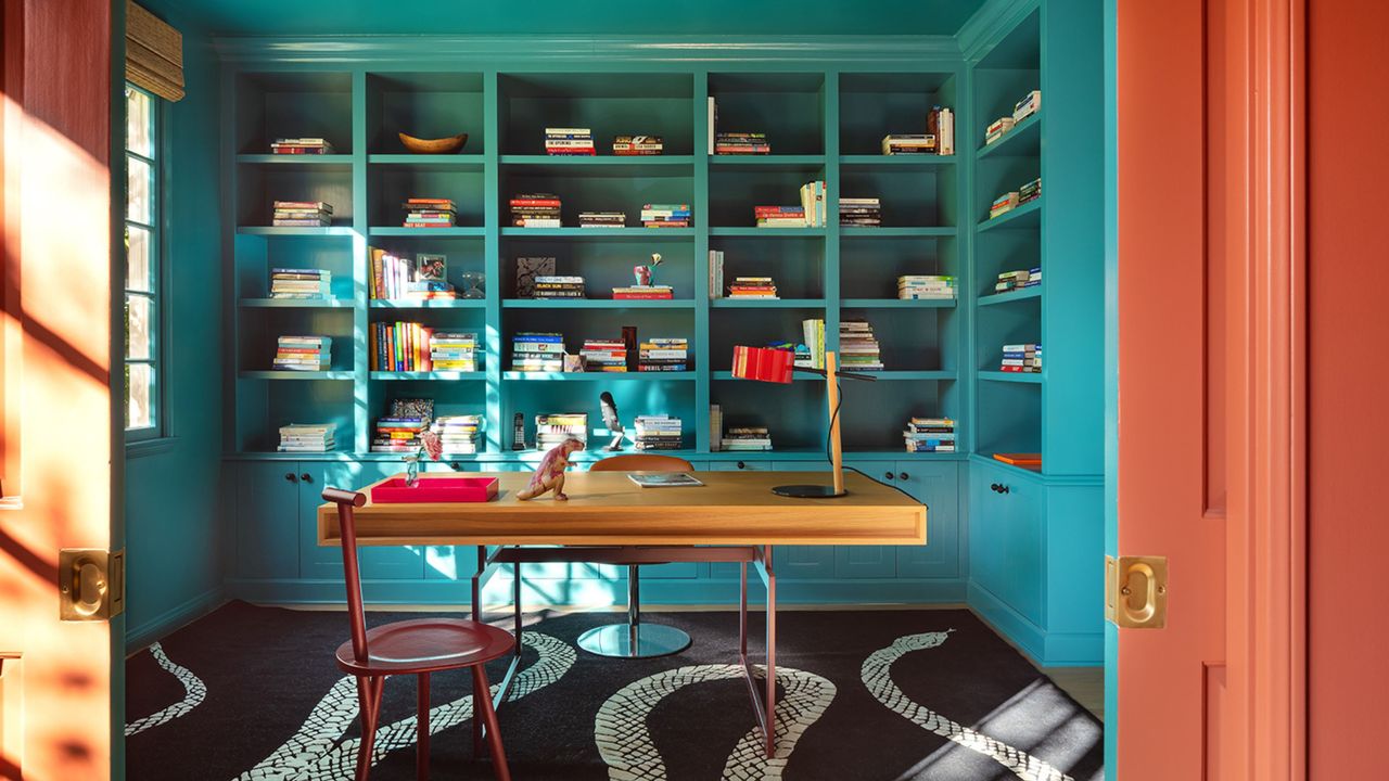 color drenched home office with salmon and teal walls