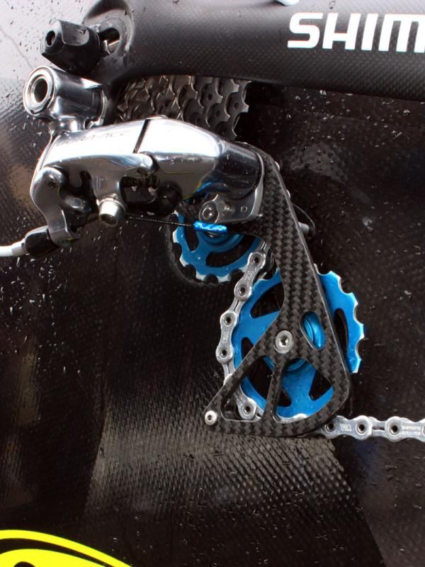 The Berner carbon fiber derailleur cage and oversized (13T upper, 15T lower) pulleys are said to noticeably reduce drivetrain friction by allowing less severe chain bends.