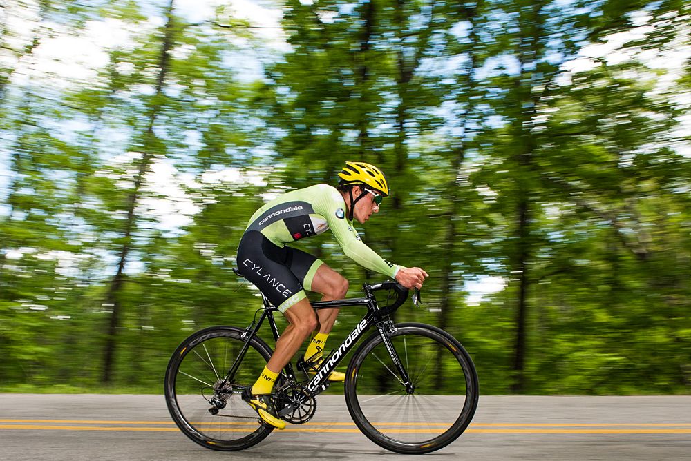 A Cylance-Cannondale Pro Cycling p/b Incycle (USA) rider takes a wide line through a turn on a switchback.