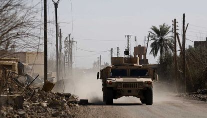 SDF fighters arrive in the village of Baghouz Al-Fawqani, Syria